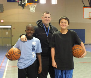 Police Athletic Leagues' Jahiem Marshall, left, officer Brandon Reece center, and Sammie Sangsawangwantana. Photo by Christina Haley.