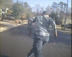 A police camera still shows Tuesday’s standoff suspect, Jermaine Junior Cordova, as he runs from police.