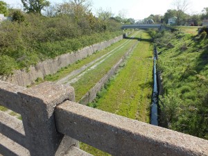 The former rail corridor, as seen from the Fourth Street bridge, facing east. Wilmington officials are eyeing the corridor as a public greenway with a multiuse path. File photo.