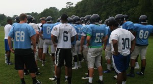 Coach Scott Braswell gives instruction to his team during practice. 