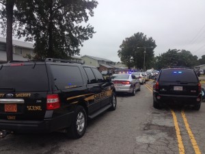 Police converge in near the Creekwood housing community where a deputy was shot Thursday afternoon. Photo by Christina Haley.