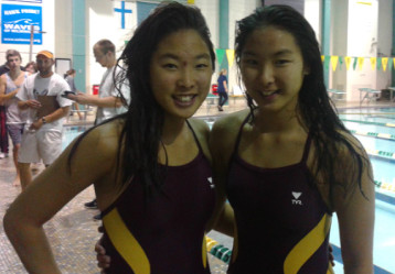 Heather (left) and Colleen Keck during a swim meet early this season at UNCW.