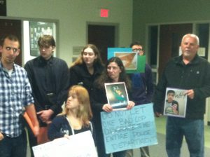 Members of Keith Vidal's family speak to the media before a press conference at the DA's Office. Staff photo by Caroline Curran.