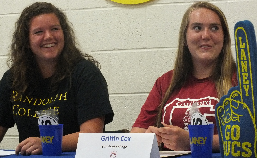 Teammates Becca Montgomery, left, and Griffin Cox will both play softball at the college level next semester. File photo. 
