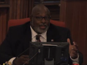 Commissioner Jonathan Barfield responds to the action plan to improve collaboration between New Hanover's health and social services departments. Image courtesy NHCTV.