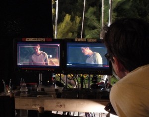 Monitors show the scenes being shot, from different camera angles.