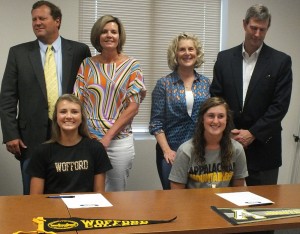 Rebecca McLean, right, and Brooke Graham pose for a picture with family on Wednesday. 
