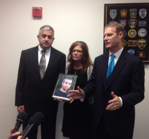 Joshua Proutey's father, Don Proutey, left, mother Patty Proutey and District Attorney Ben David speak to the media at the close of court. Photo by Christina Haley.
