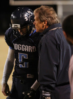 Scott Braswell, right, talks with quarterback Austin Shoenleber during a game in 2014. 