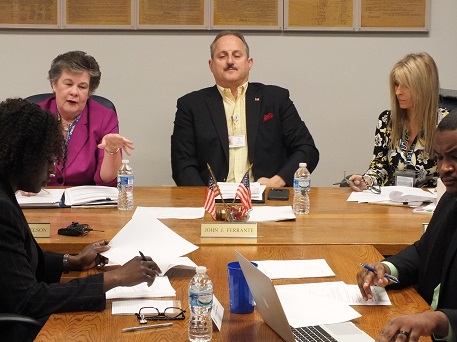 Board member Tannis Nelson states her objection to a motion during Tuesday's meeting alongside Chairman John Ferrante and fellow board member Marlene Mitchell, from left. The board voted 2-1 to appoint Derek Bowens, seen at right, as interim elections director following the recent removal of Marvin McFadyen. Photos by Jonathan Spiers.