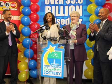 Picture from left to right are financial adviser Dexter Perry, Powerball jackpot winner Marie Holmes, N.C. Education Lottery executive director Alice Garland, and attorney Charles Francis.