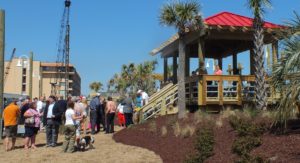 Carolina Beach and New Hanover County officials held a grand opening ceremony of the revamped Carolina Beach oceanfront boardwalk. Photo by Caroline Curran.