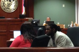 Montey Murray speaks with attorneys while on trial for first-degree murder. Photo by Christina Haley.