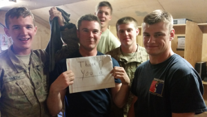 U.S. Army troops after receiving last January's Packages from Home. Photos courtesy Step Up for Soldiers.