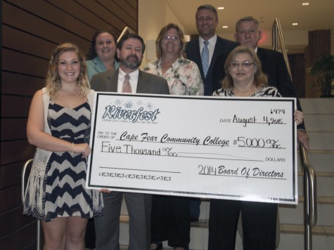 CFCC student  Jenna Colthorp accepts a scholarship check from Riverfest committee members Jill Vale, Chris Snowden, Karen Daniels, David Gross, PC Snowden and Donna Worrell. Photos courtesy CFCC. 