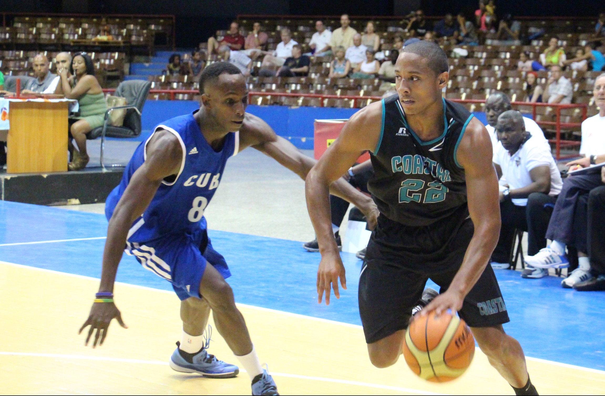 Elijah Wilson drives to the hole during a game in Cuba. 