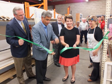 Wilmington mayor Bill Saffo and mayor pro tem Margaret Haynes, center, celebrate the reopening of Legacy Architectural Salvage Wednesday with members of Historic Wilmington Foundation. Photos by Hilary Snow.