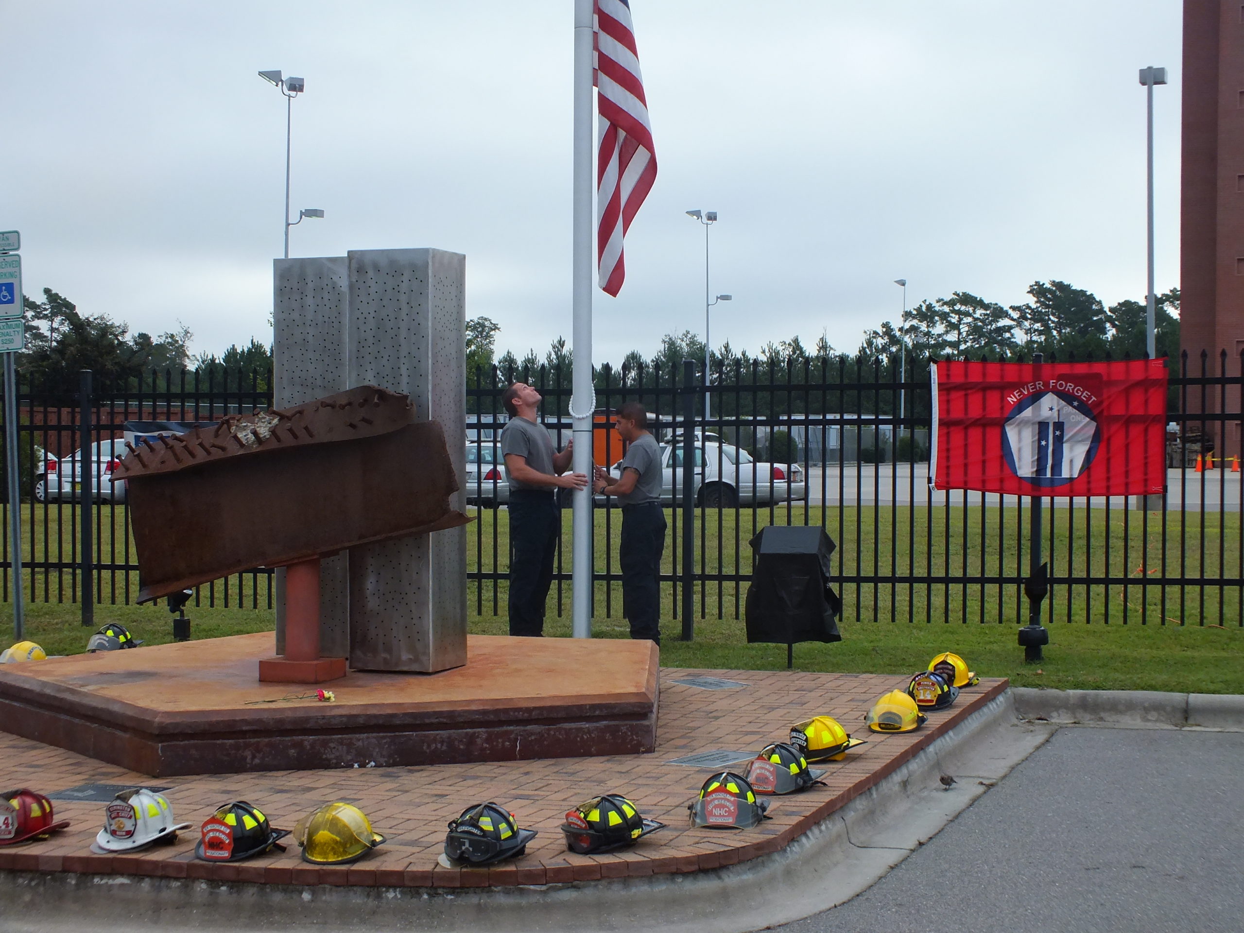 CFCC emergency safety training students lower the flag to half mast Friday morning during a 9/11 ceremony at the college's north campus. Photos by Hilary Snow.