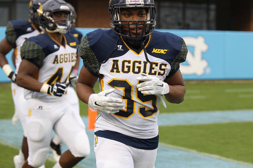 Keevin Thompson, right and Julis Reynolds take the field at Kenan Stadium. Photo courtesy- John Crouch