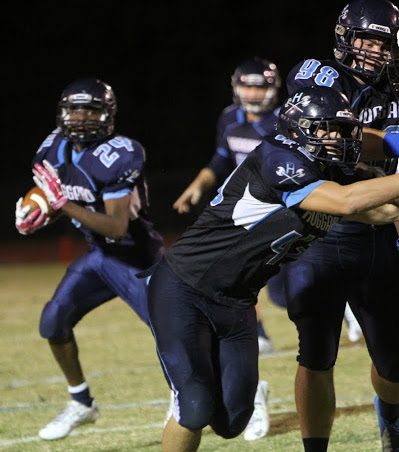 Rashad Wallace gets a few blocks around the edge. Photos courtesy- Rodney Williams