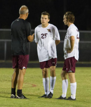 Greg Marinich, left, has coached Ashley to a 16-0 mark in his first season.