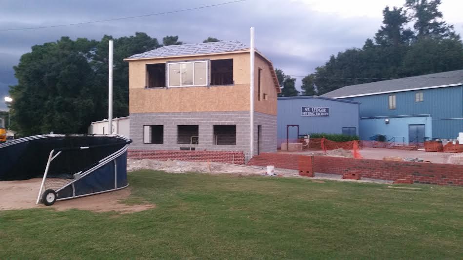 The press box and concession stand is raised along with the brick backstop. 