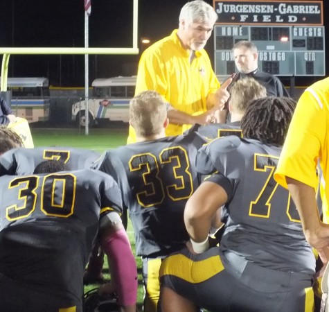 Topsail Coach Wayne Inman addresses his team after the game. 