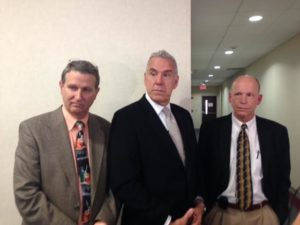 Members of Wilmington Plastic Surgery spoke with media after Wednesday's sentencing in an embezzlement case that stemmed from within their practice. Doctors Kenneth S. White, left, Charles R. Kays, and Jeffrey S. Church, hope business owners will learn from the case. Photo by Christina Haley.
