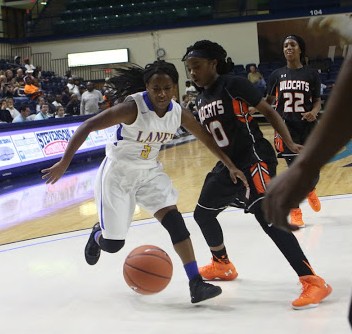 Azariah Fields, right, guards Jayda Malone. Photos courtesy- Rodney Williams