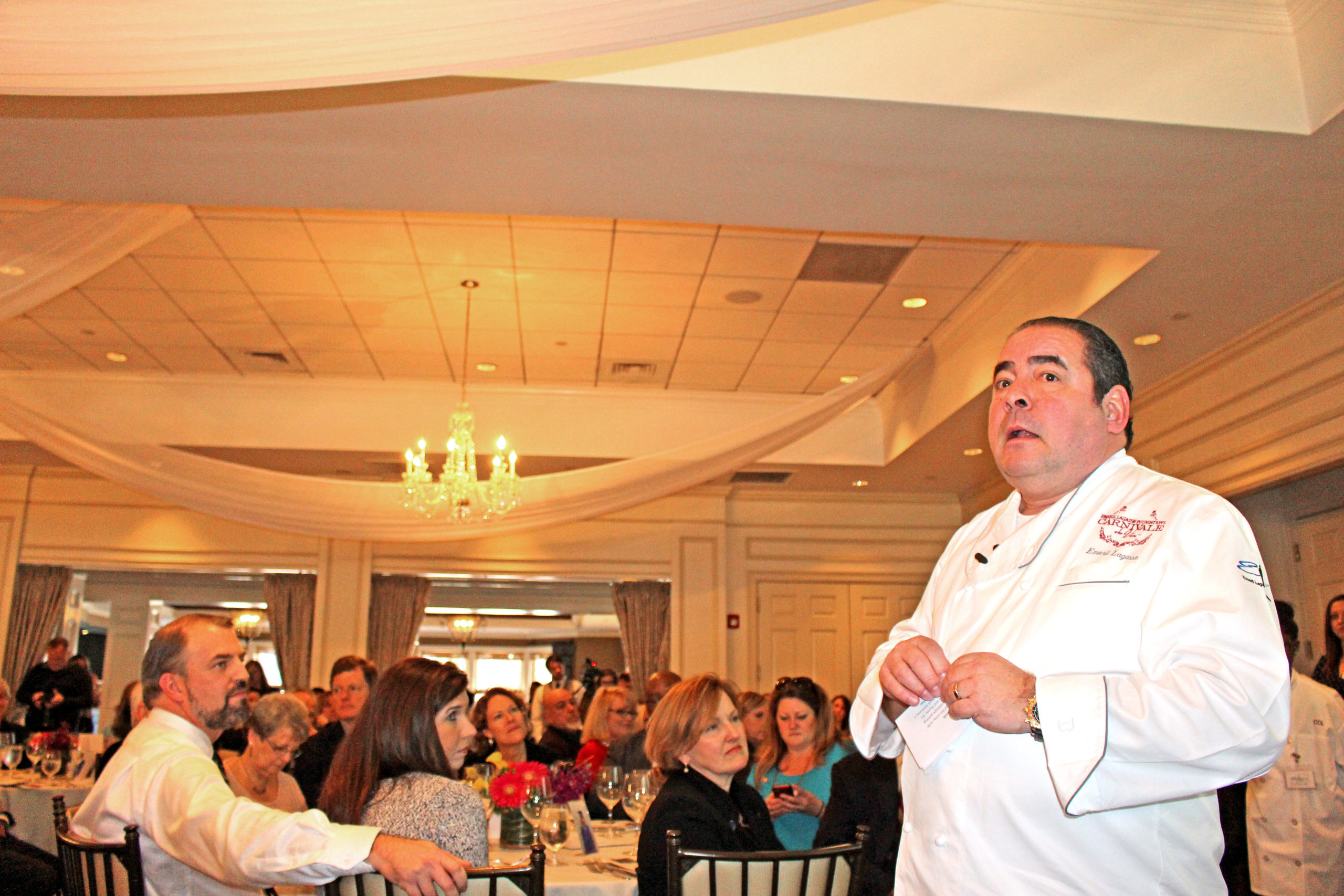 Celebrity chef Emeril Lagasse welcomes a crowd of nearly 300 during a luncheon Friday to raise money for an all-girls public charter school in Wilmington. Photos by Hilary Snow.