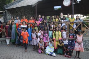 Wilmington Yoga Center members with girls from a Homes of Hope orphanage in southern India during the 2015 Kunga Journeys Service Retreat. Courtesy of Wilmington Yoga Center.