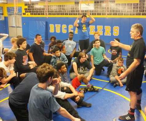 Coach Willis instructs the Wrestling Bucs before practice.