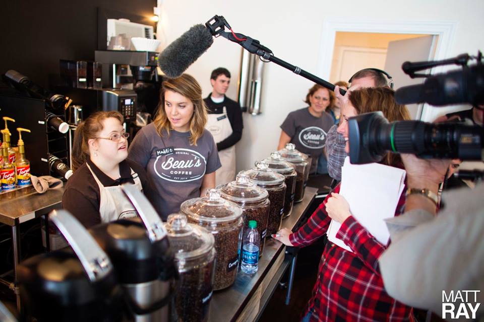 A Beau's Coffee employee is interviewed by 'The Rachael Ray Show' crew last week. Ray, who heard about the unique business via social media, is featuring Beau's on her show Wednesday. Photos courtesy M. Ray Photography.