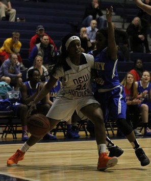 Ayonna Cotten, left, drives baseline on Jayda Malone.