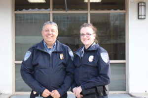 Cape Fear Police Chief Dan Wilcox stands with fellow officer Maggie Bet