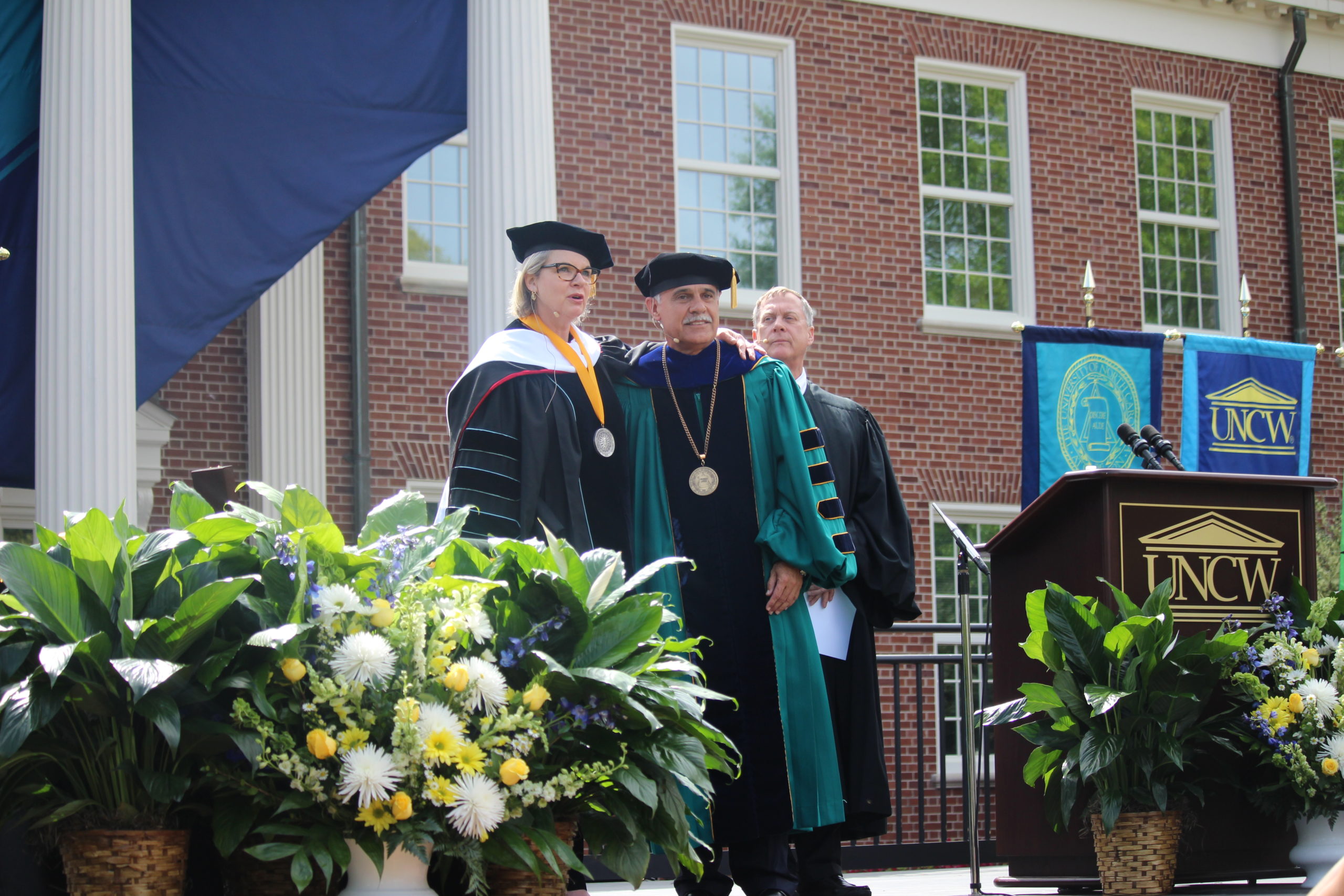 UNC system president Margaret Spellings officially welcomes Zito Sartarelli to the Seahawk family after presenting him with a UNCW medallion during an formal chancellor installation ceremony Thursday. Photos by Hilary Snow.