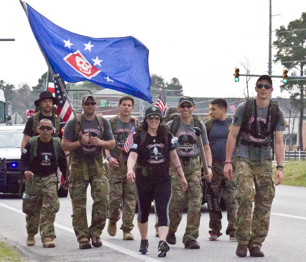 A group of marching Marine Raiders makes their way up Highway 17 in Leland on Saturday. Photo by Hannah Leyva.