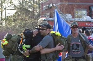 There was no shortage of hugs for the marching Marines on Saturday. Photo by Hannah Leyva.