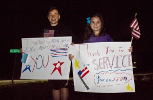 Cooper and Georgia Ford made signs and cards for the marching Marines. Photo by Hannah Leyva.