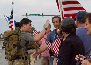 Marine Raider Memorial March organizer Staff Sgt. Nathan Harris, left, greeted supporters in Leland on Saturday. Photo by Hannah Leyva.