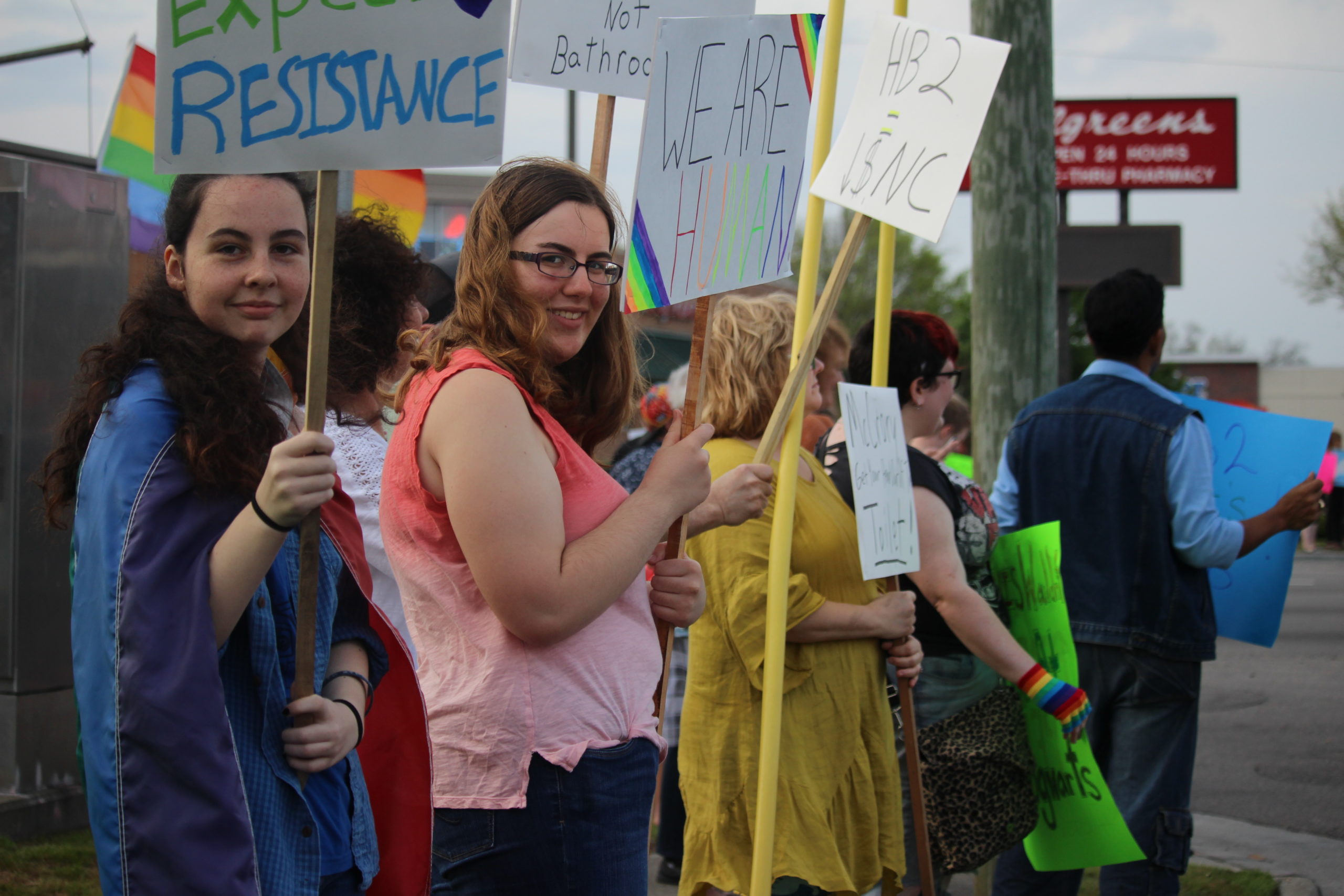 A total crowd of around 50 occupied the four corners of the busy midtown intersection during the two-hour rally.