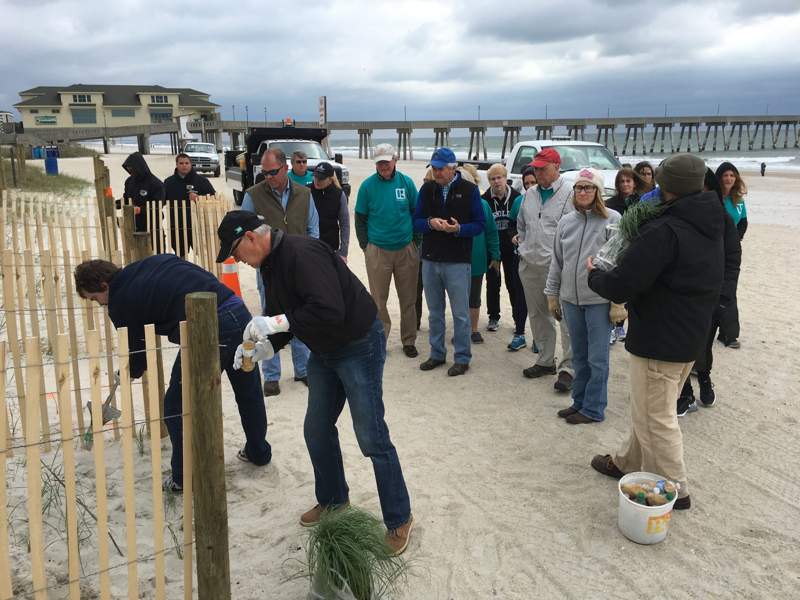 Real estate agents from across the area team up to plant sea oats in Wrightsvillle Beach during the second annual Realtor Action Day. Courtesy photos.