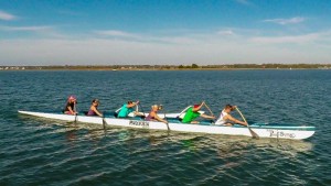 A six-man Hawaiian outrigger canoe race is a new addition to the Carolina Cup this year. Photo courtesy of Peter Newman, WILM Aerial Images.