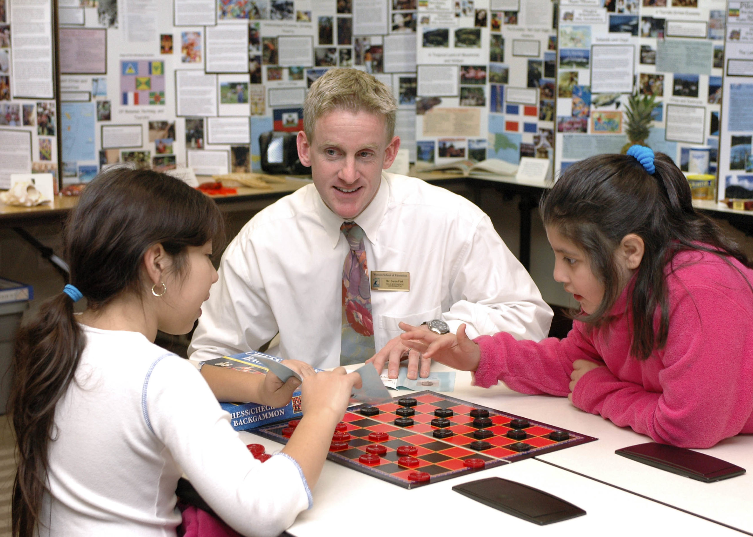 Devon Fort, a field experience coordinator with the Watson College of Education, chats with Bradley Creek Elementary School students as part of a coordinated visit from teachers in training. Watson and UNCW are calling local residents to celebrate the profession on Teacher Appreciation Day by sharing memories of their favorite teachers via Twitter. Photo by Jamie Moncrief.