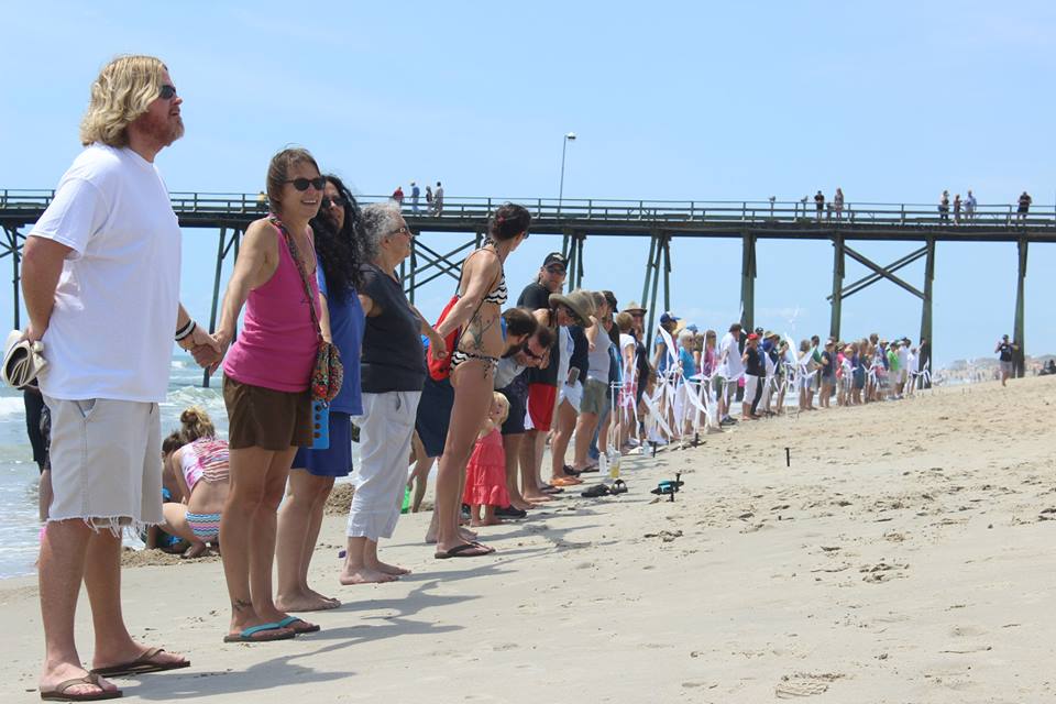 Hands Across the Sand 2015 in Kure Beach. Photo courtesy of the Surfrider Foundation Cape Fear Chapter.