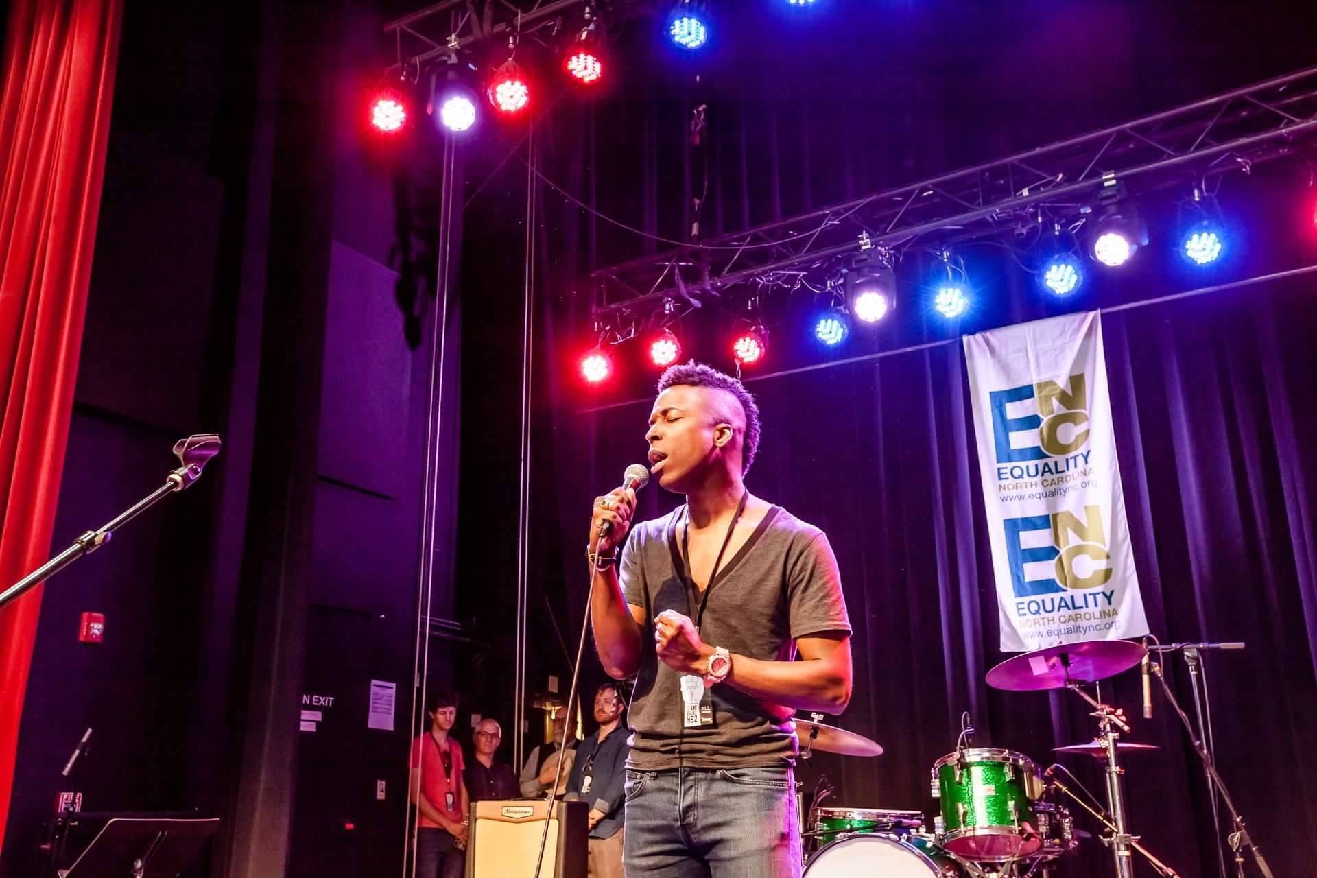 Orlando Parker Jr. sings the National Anthem at the start of Stand Against HB2's first concert near Burlington earlier this month. The loose collective of NC musicians will perform in Wilmington in July as part of a statewide tour to raise funds for fighting the controversial law. Courtesy photo.