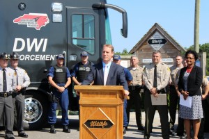 District Attorney Ben David stands at the podium during Tuesday's press conference to talk about the penalties facing impaired drivers.