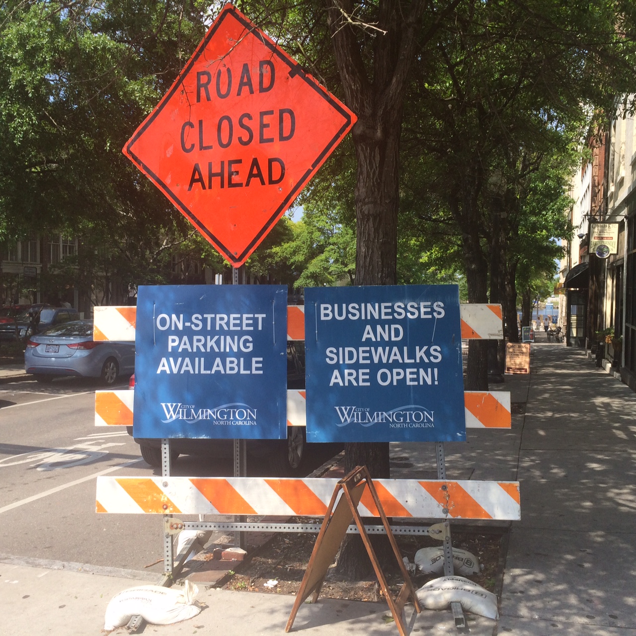 Signs at the corner of Front and Market streets alert downtown visitors of the roadwork along the riverfront. Although signs noting shops are still open have been posted, business owners on Market have seen a slowdown in foot traffic since the work began. Photos by Hilary Snow.