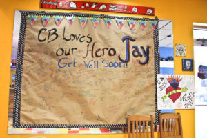 A giant poster and card were set up on a wall in the waiting area of Flaming Amy's Burrito Barn in Carolina Beach last week. Photo by Hannah Leyva.