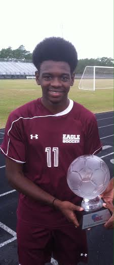 Duenis Avila holding the 2015 MEC Championship Trophy. Photo courtesy: Greg Marinich